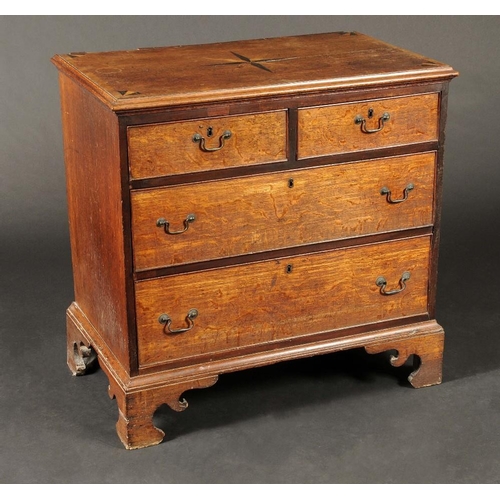 1717 - A George III oak chest, of small proportions, mahogany crossbanded top inlaid with a starburst and b... 