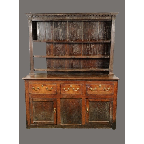 1719 - A George III oak dresser, stepped Greek key cornice above open shelves, reeded frieze and angles, pr... 