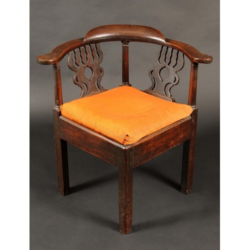 1724 - A George III provincial mahogany corner chair, shaped and pierced splats, drop in seat, chamfered sq... 