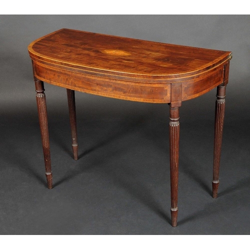 1728 - A George III rosewood crossbanded mahogany D-shaped card table, folding top inlaid with an oval shel... 