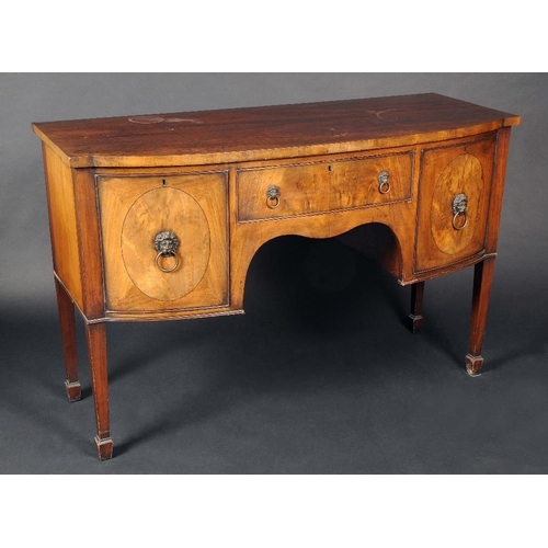 1733 - A George III style mahogany bow fronted sideboard, oversailing top above a drawer and a pair of  doo... 