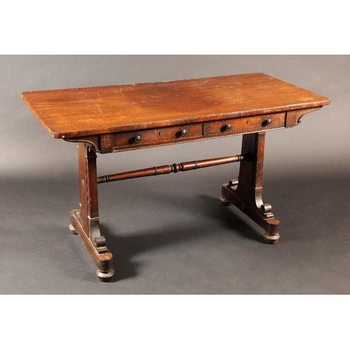 1735 - A George IV mahogany rounded rectangular library table, oversailing top above a pair of frieze drawe... 