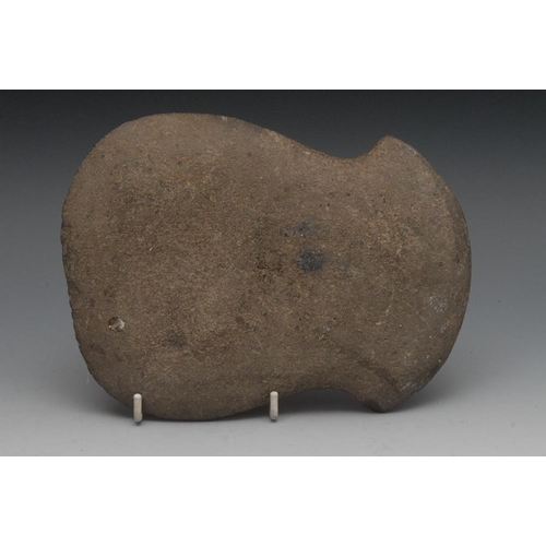 2562 - Antiquities - an unusually large Neolithic flattened waisted stone axe head, possibly of Balkan orig... 