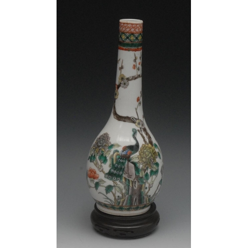 68 - An 18th century bottle vase, decorated in the Famille Verte palette, with peacock, peonies and bloss... 