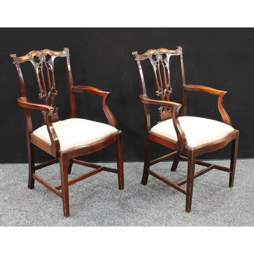 411 - A pair of Chippendale Revival mahogany armchairs, carved in relief, serpentine front rails, early 20... 