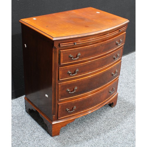 414 - A George III style crossbanded mahogany bow fronted bachelor’s chest, brushing slide above four draw... 