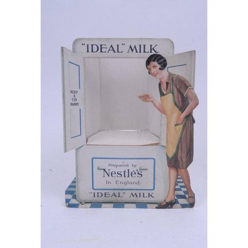 1049 - Nestle - an early 20th century cardboard three dimensional showcard, ''Ideal'' Milk, printed in poly... 