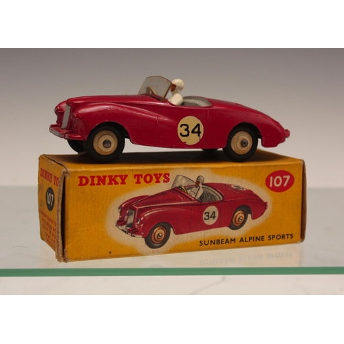 252 - Dinky Toys 107 Sunbeam Alpine Sports, dark pink body, grey interior, white driver, cream hubs, racin... 