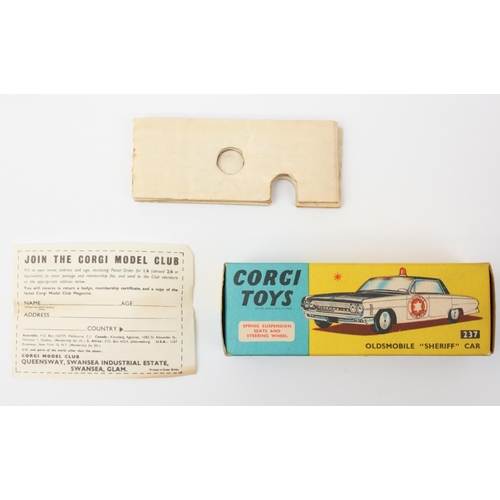 55 - Corgi Toys 237 Oldsmobile Sheriff's car, white body, black roof, clear light to roof, boxed with inn... 