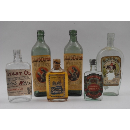 687 - Pease, Son & Co- A late 19th/early 20th century square green glass bottle, The Gladiator Whisky, Fin... 