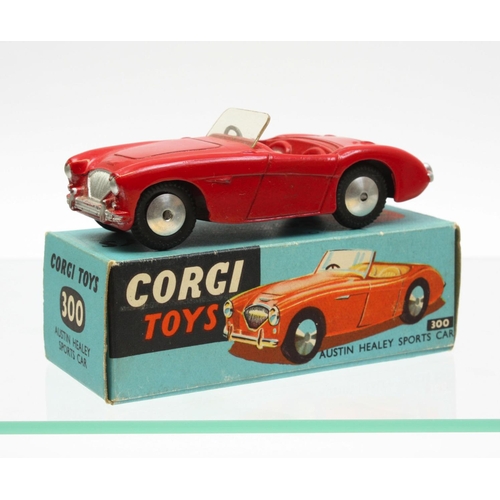 69 - Corgi Toys 300 Austin Healey 100-4 Sports car, red body, red and cream interior, windscreen intact, ... 