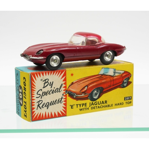 75 - Corgi Toys 307 Jaguar 'E' type, plum red body and roof, spun hubs, boxed with inner cardboard packin... 