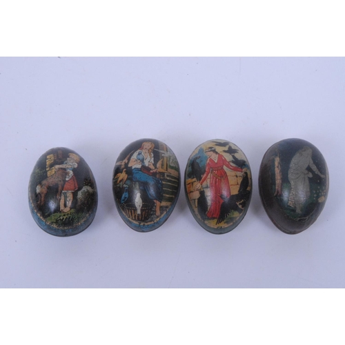 877 - A mid 20th century egg shaped confectionery tin, lithograph printed with medieval lady feeding crows... 