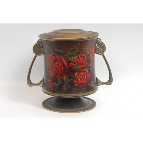 394 - An early 20th century novelty confectionary tin, as a waisted cylindrical two handled jar and cover,... 