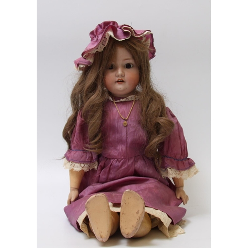 300 - An Armand & Marseille bisque head, part composition and kid leather ball jointed body doll, sleeping... 