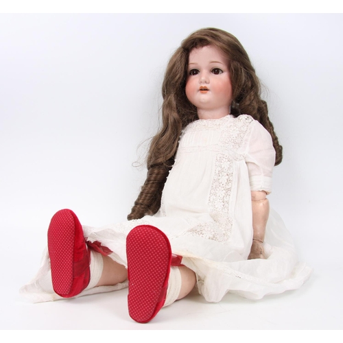 302 - A large Armand & Marseille bisque head and composition ball jointed body doll, sleeping brown glass ... 