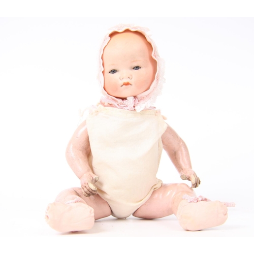 303 - An Armand & Marseille bisque head and composition bent limb body doll, small sleeping blue glass eye... 