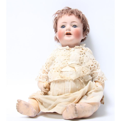 303A - A Simon & Halbig bisque head and composition bent limb body doll, sleeping blue glass eyes, painted ... 