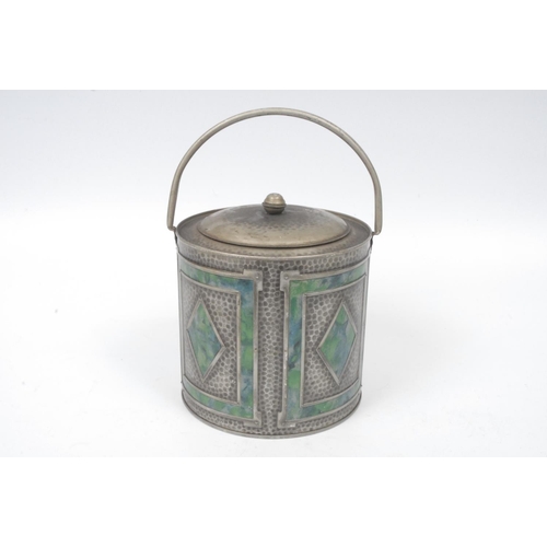 406 - John Buchanan & Bros Ltd - an early 20th century faux beaten pewter biscuit 'barrel', decorated in m... 