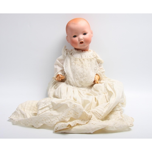 304 - An Armand & Marseille bisque head and composition bent limb body doll, sleeping blue glass eyes, ope... 