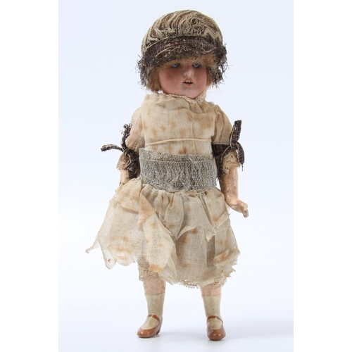 307A - An Armand & Marseille bisque head and composition bent limb body doll, sleeping blue glass eyes, pai... 