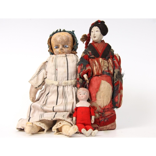 310 - An early 19th Century wax over composition head doll, fixed blue glass eyes, partly stuffed body, co... 