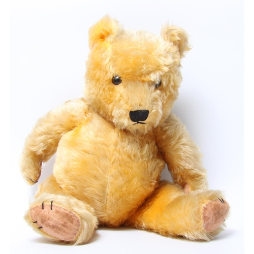 315 - A golden mohair teddy bear, brown and black plastic eyes, vertically black stitched nose and mouth, ... 