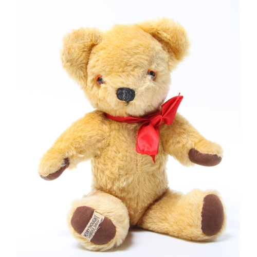 316 - A Merrythought golden plush teddy bear, amber and black plastic eyes, vertically black stitched nose... 