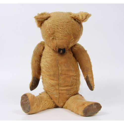 317 - A Merrythought blonde mohair teddy bear, vertically black stitched nose, leather type pads to hands ... 