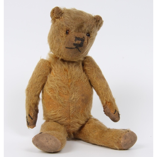319 - A blonde mohair straw filled teddy bear, amber and black plastic eyes and a pronounced snout , verti... 