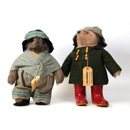 321 - A Paddington bear, wearing green coat and red Wellington boots with tag, 54cm tall; an Aunt Lucy bea... 