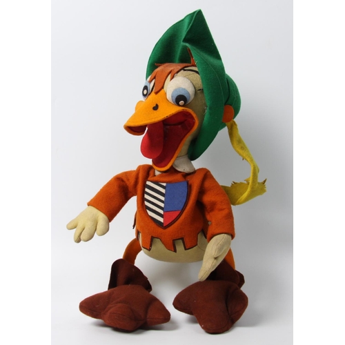 324 - A novelty felt duck dressed as a Muskateer, felt blue eyes, large orange beak, wearing a green Muska... 