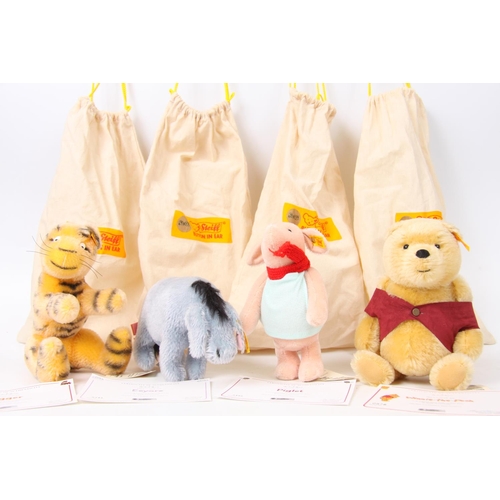 336 - Steiff Winnie the Pooh, serial No 0978 with certificate of authenticity and draw string bag; Steiff ... 