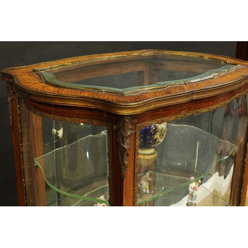 278 - A 19th century Louis XV Revival gilt metal mounted rosewood serpentine room centre bijouterie vitrin... 