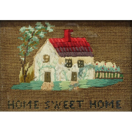 144 - A Victorian woolwork picture of a cottage, Home Sweet Home, 20.5cm x 25.5cm overall
