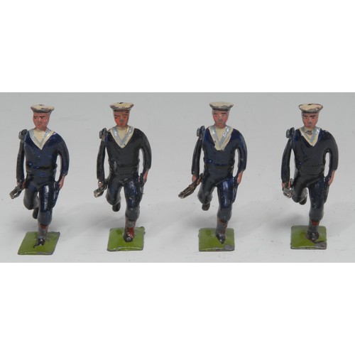 2385 - W Britain (Britains) four Bluejackets of the Royal Navy lead figures, each carrying a rifle at the t... 