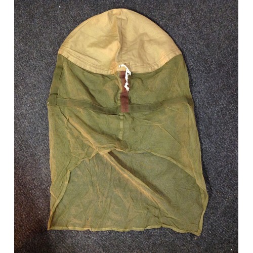 109 - WW2 British Helmet Mosquito Net. Maker marked and dated 