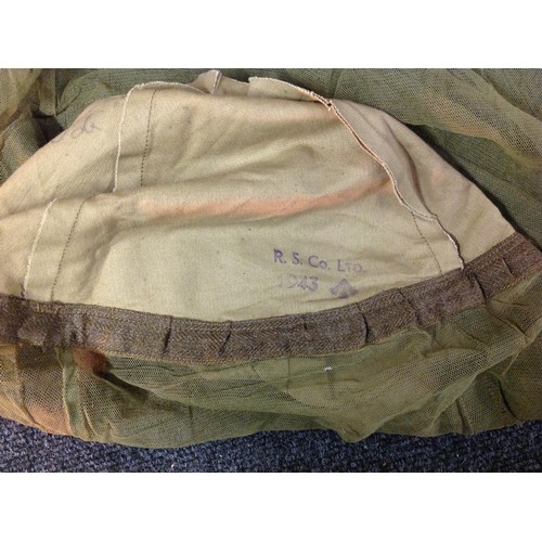 109 - WW2 British Helmet Mosquito Net. Maker marked and dated 