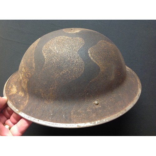 119 - WW2 British Steel Helmet with original camouflage paint. Shell only, no liner or chinstrap. The camo... 