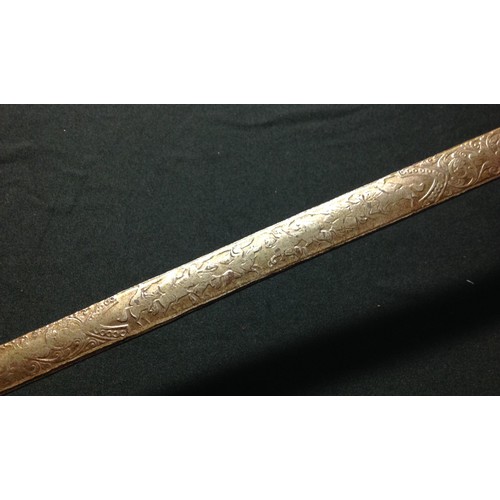 440 - Dress Sword with 77.5cm long double edged blade with etched decoration.  No makers mark. Brass guard... 