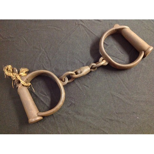 465 - A Pair of Victorian Police Handcuffs. Complete with key. Maker marked 