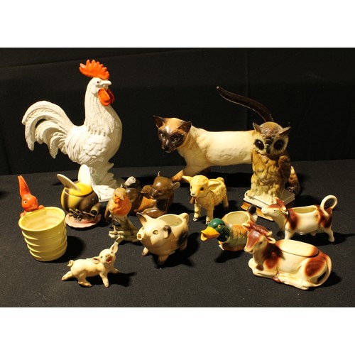 299 - A Goebel large model of a siamese cat, 24cm high; a Cortendorf model of a cockerel, 31cm high; a Goe... 