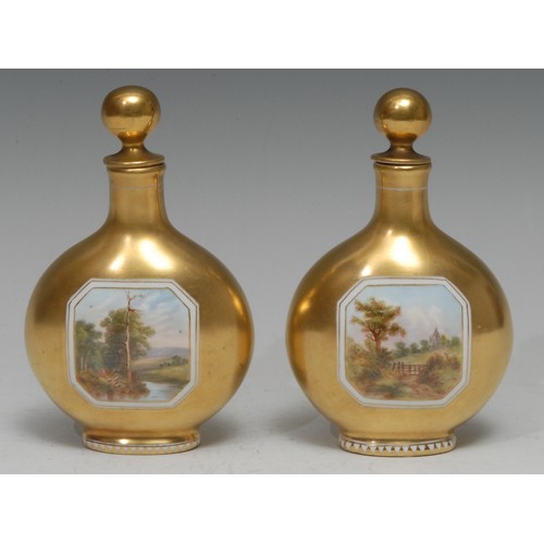 102 - A pair of Coalport pilgrim flask scent bottles, each painted with a canted rectangular landscape vig... 