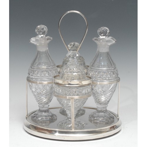 752 - Matthew Boulton - a George III silver oval four bottle dessert cruet, the reeded frame restraining p... 