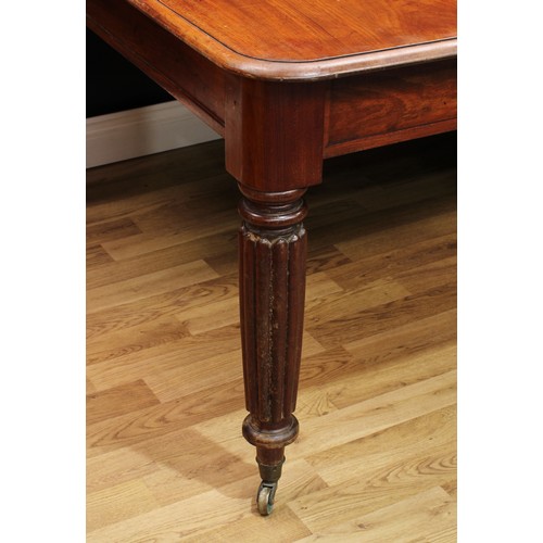1018 - A Regency mahogany 'five-leg' extending dining table, rounded rectangular top with one additional le... 