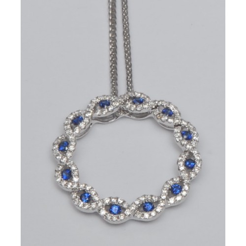 776 - A contemporary sapphire and diamond circular pendant necklace, circular body inset with twelve round... 