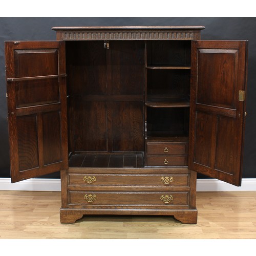 1504 - Frank Pratt of Derby - a 17th century style oak press cupboard or hall robe, rectangular top with mo... 