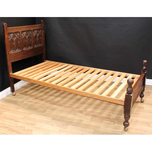 1512 - Frank Pratt of Derby - a pair of 17th century design oak beds, each headboard crested by a nulled fr... 