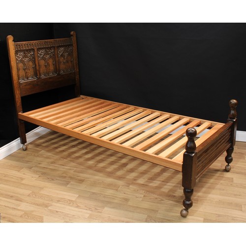 1512 - Frank Pratt of Derby - a pair of 17th century design oak beds, each headboard crested by a nulled fr... 