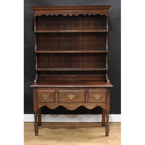 1510 - Frank Pratt of Derby - a George III style oak dresser, moulded cornice above a shaped apron and thre... 